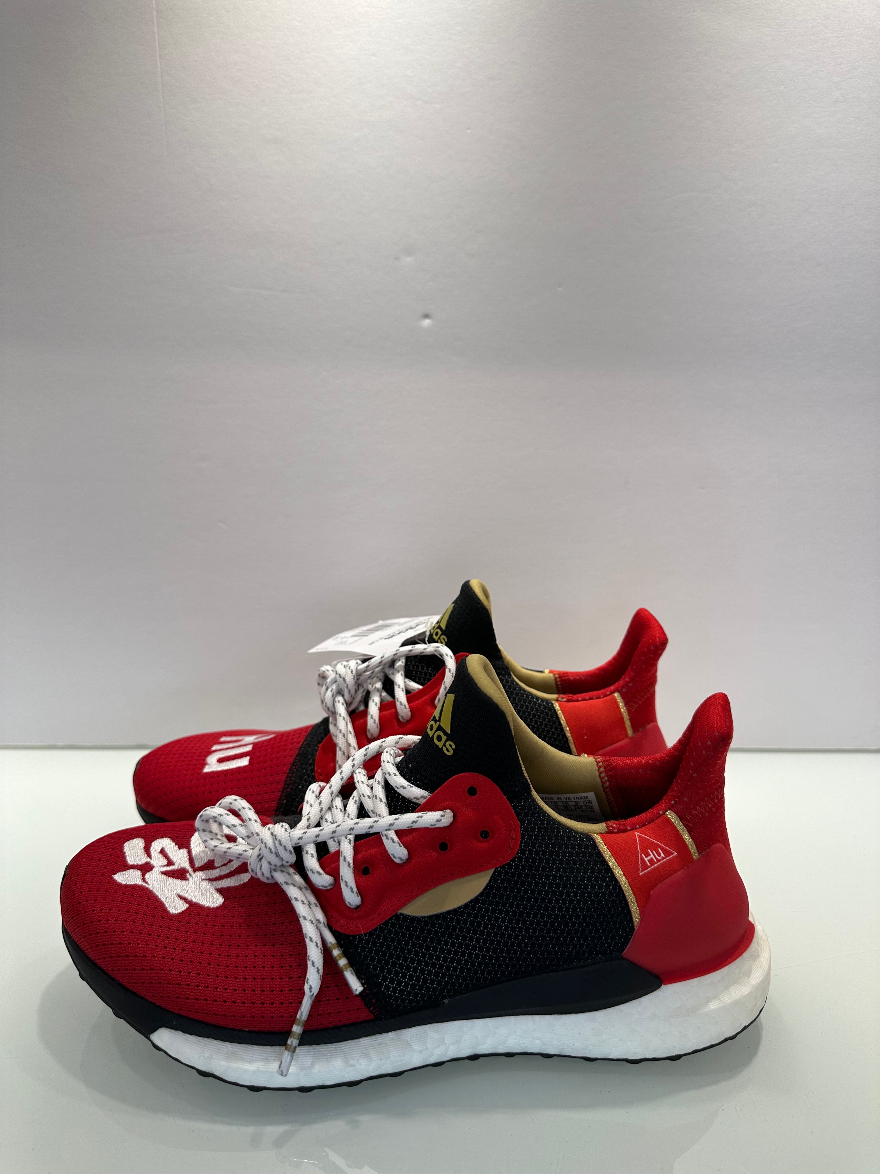 pharrell williams red sneakers