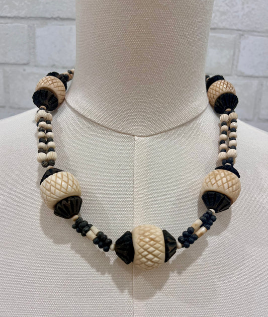 African necklace with small and big carved beads