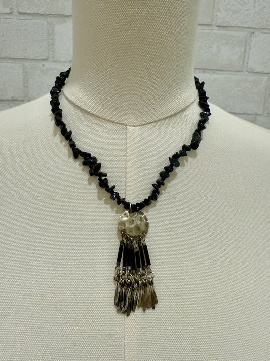 black beads and silver pendant