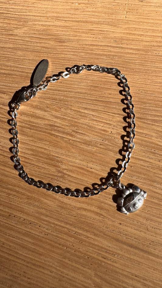 Silver bracelet with little girl charm