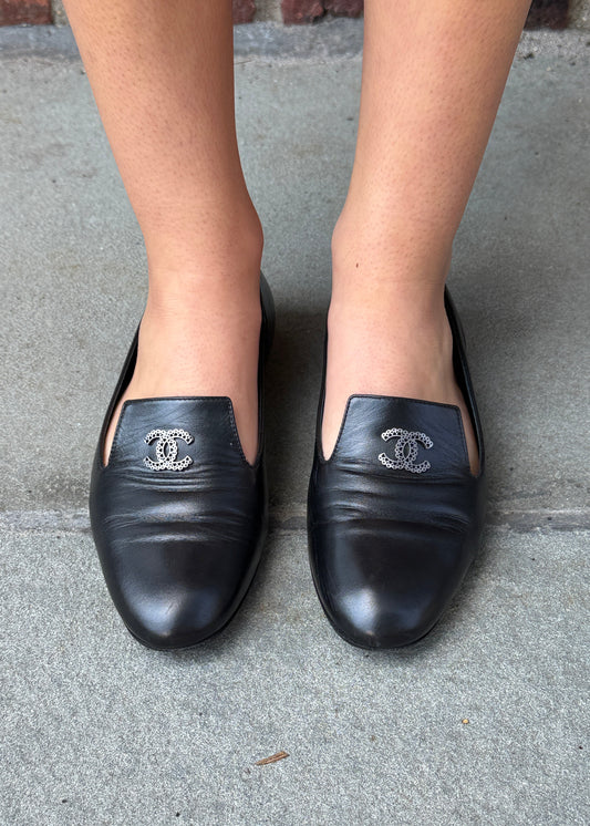 Chanel CC logo loafer black leather worn on foot front view