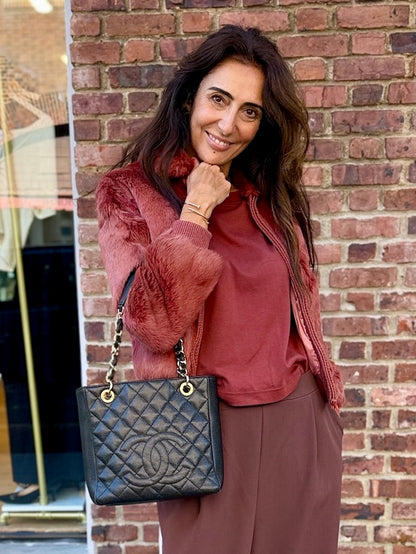Chanel Petite Shopping Tote black caviar leather bag worn on shoulder street style Second Edition